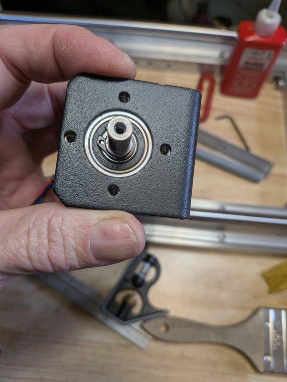 Boom motor drive mount and spacer