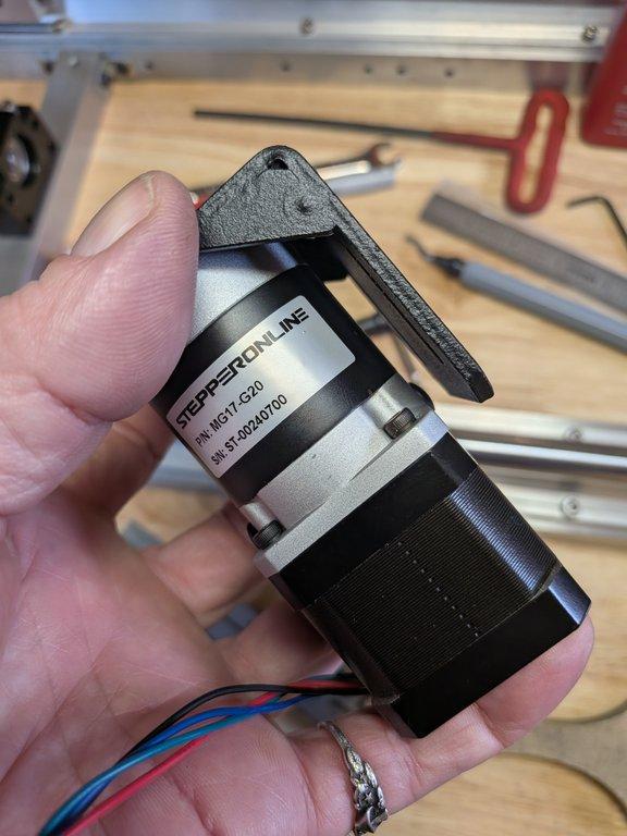 Boom motor drive mount and spacer