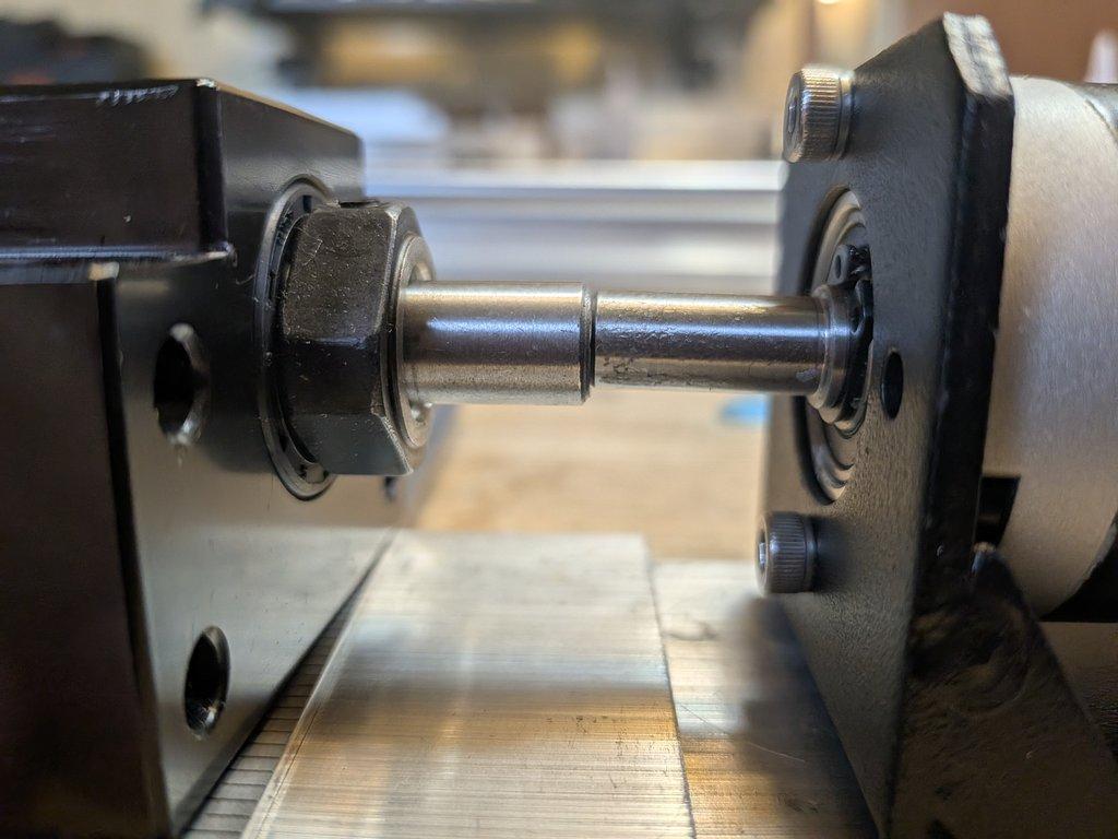 Boom motor drive mount and spacer