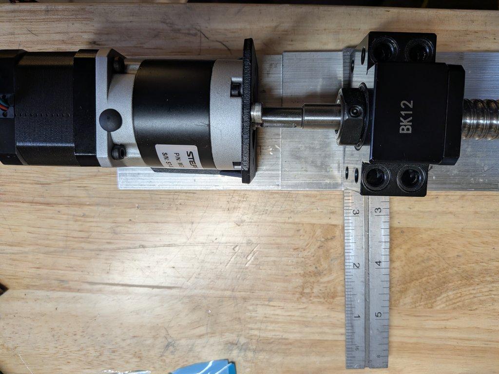 Boom motor drive mount and spacer