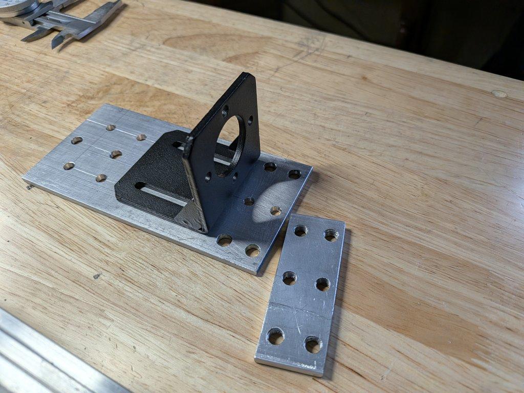 Boom motor drive mount and spacer